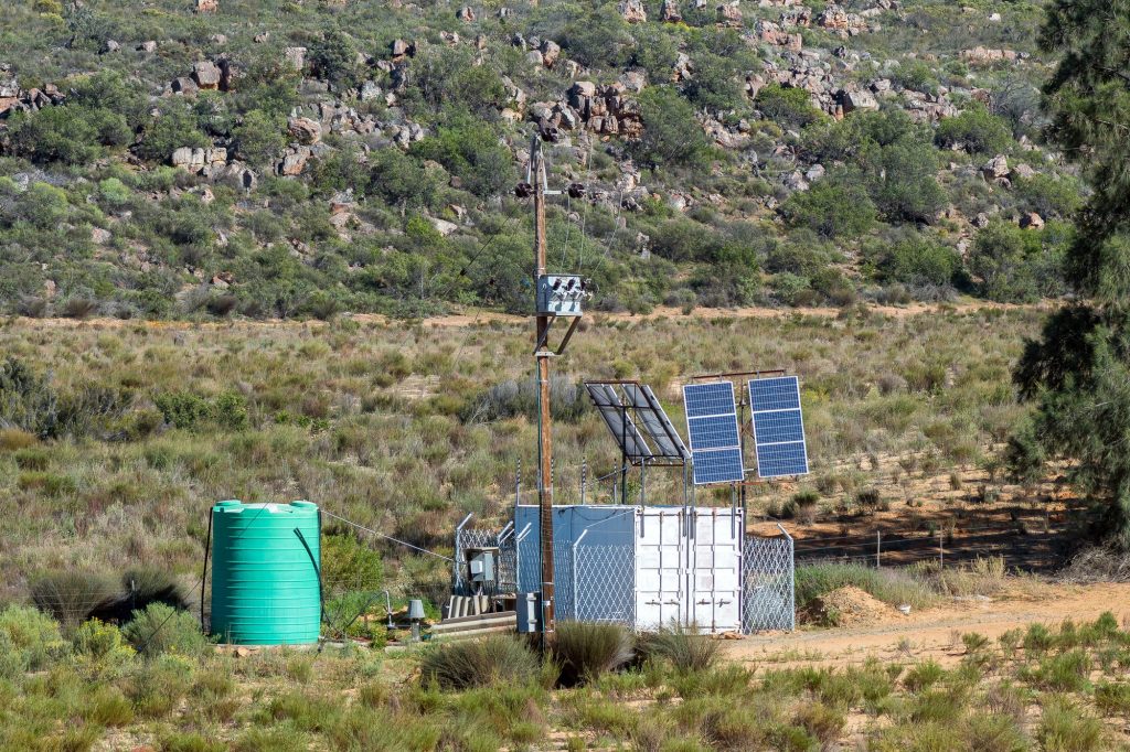 Power line, transformer, solar backup, water tank on Nieuwoudt Pass